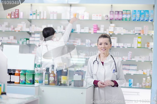 Image of team of pharmacist chemist woman  in pharmacy drugstore