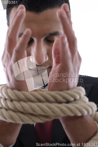 Image of business man with rope isolated on white background