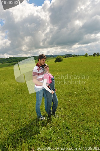 Image of romantic young couple in love together outdoor