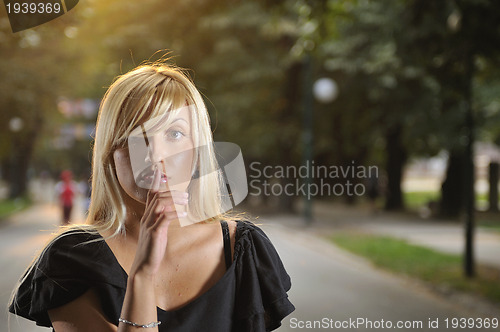 Image of brunette Cute young woman  posing outdoors