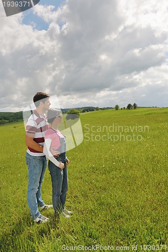 Image of romantic young couple in love together outdoor