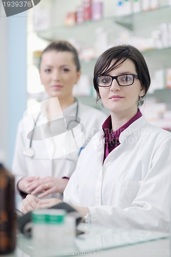 Image of team of pharmacist chemist woman  in pharmacy drugstore