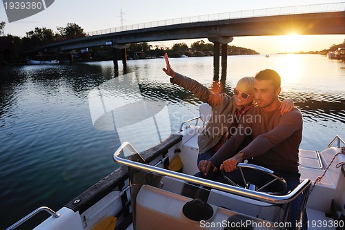 Image of couple in love  have romantic time on boat