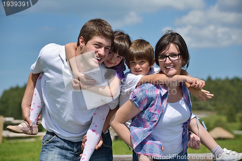 Image of happy young family have fun outdoors