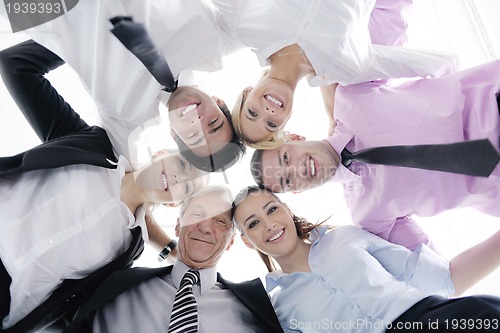 Image of business people with their heads together