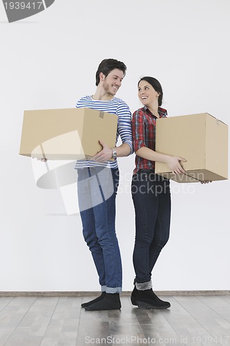 Image of Young couple moving in new home