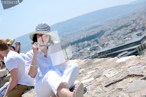 Image of Greek woman on the streets of Oia, Santorini, Greece