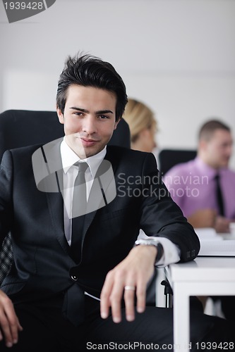 Image of young business man at meeting