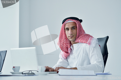 Image of arab business man at bright office