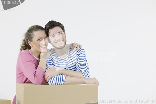 Image of Young couple moving in new home