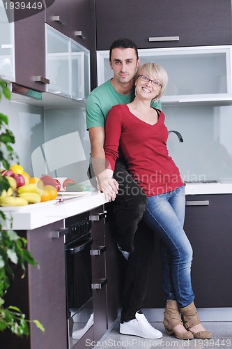 Image of young couple have fun in modern kitchen