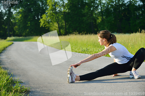 Image of woman stretching before fitness