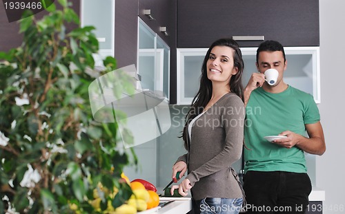 Image of young couple have fun in modern kitchen