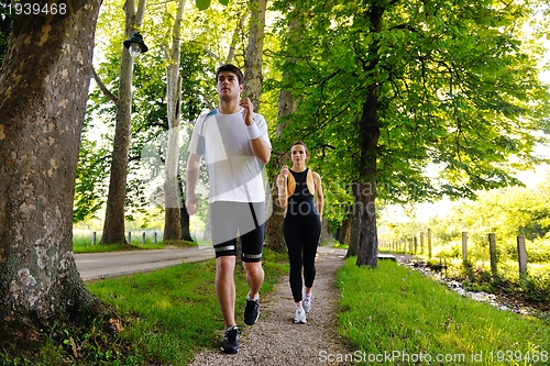 Image of Young couple jogging