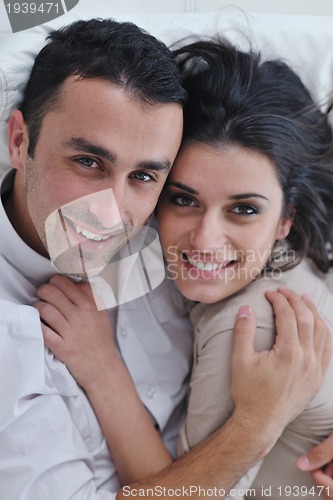 Image of happy young couple relax at home