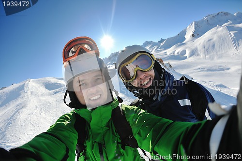 Image of winter portrait of friends at skiing