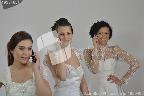 Image of portrait of a three beautiful woman in wedding dress