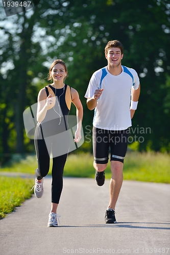 Image of Young couple jogging