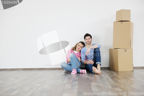 Image of Young couple moving in new house