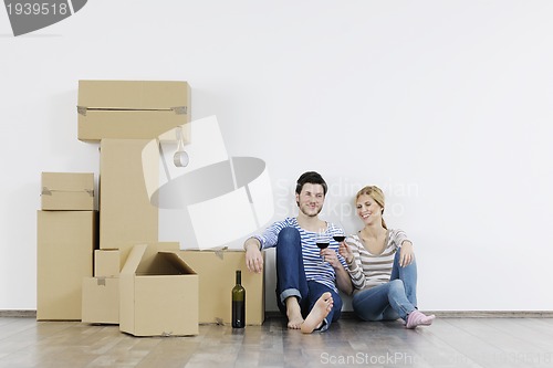 Image of Young couple moving in new home