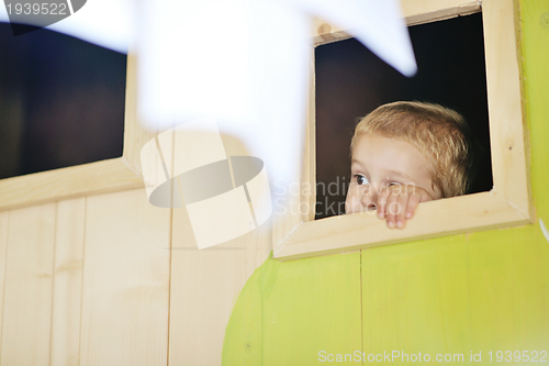 Image of happy child in a window