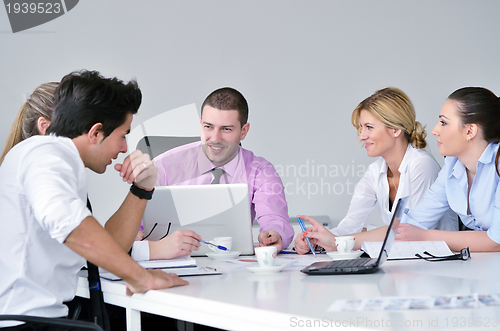 Image of Group of young business people at meeting