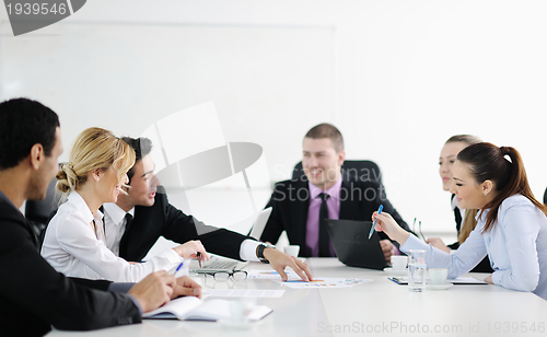 Image of Group of young business people at meeting