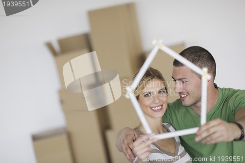 Image of Young couple moving in new home