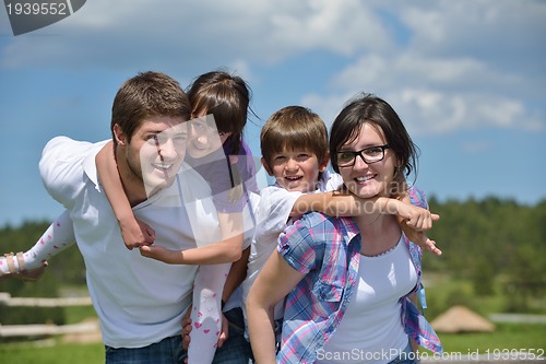 Image of happy young family have fun outdoors