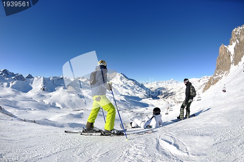 Image of winter portrait of friends at skiing