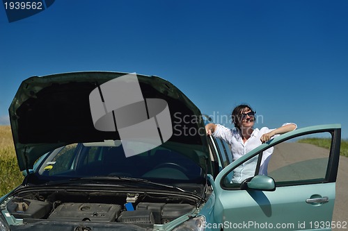 Image of woman with broken car