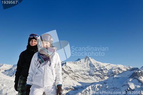 Image of winter portrait of friends at skiing