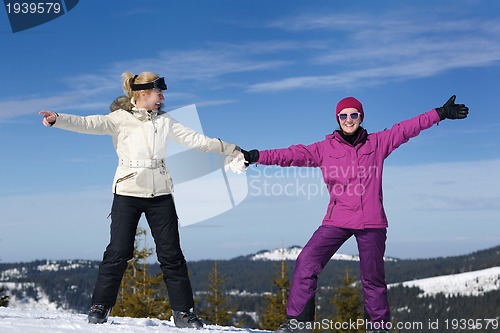 Image of winter season fun with group of girls