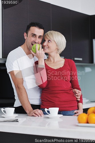 Image of young couple have fun in modern kitchen