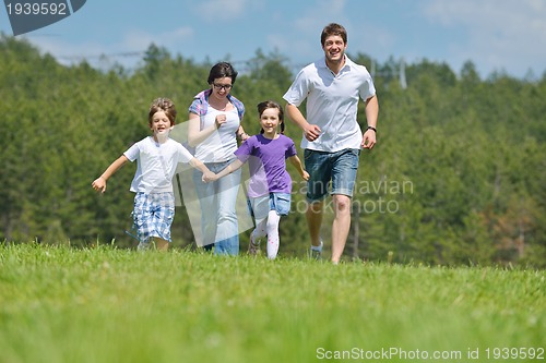 Image of happy young family have fun outdoors
