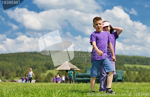 Image of happy kids group  have fun in nature