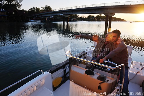 Image of couple in love  have romantic time on boat