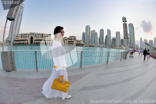 Image of happy tourist woman