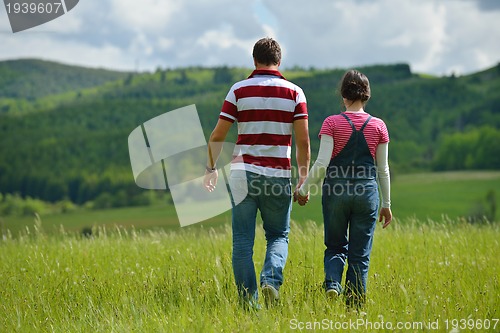 Image of romantic young couple in love together outdoor