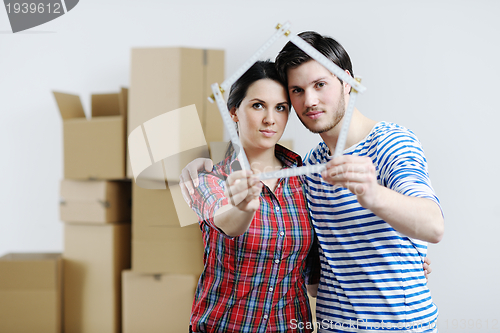 Image of Young couple moving in new house
