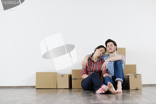 Image of Young couple moving in new house