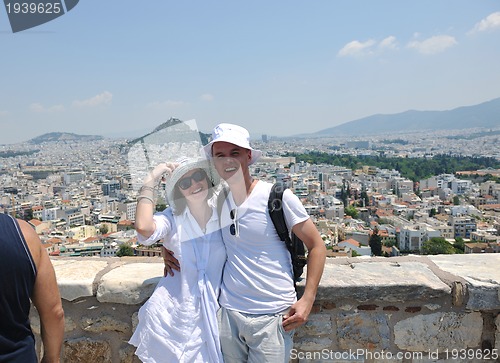 Image of happy young couple tourists in greece