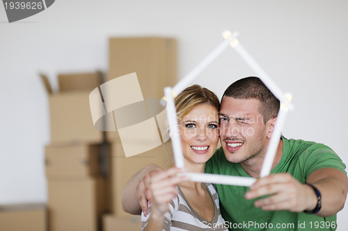 Image of Young couple moving in new house