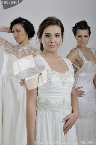 Image of portrait of a three beautiful woman in wedding dress