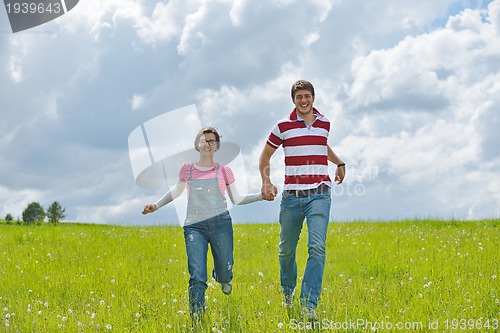 Image of romantic young couple in love together outdoor
