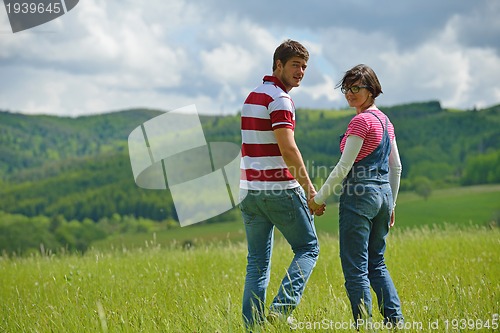 Image of romantic young couple in love together outdoor