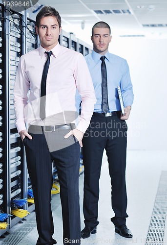 Image of it enineers in network server room