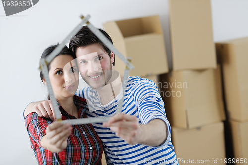 Image of Young couple moving in new house