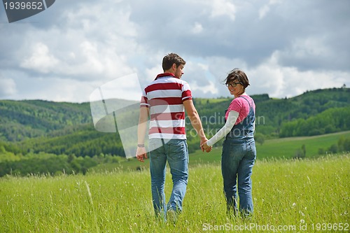 Image of romantic young couple in love together outdoor
