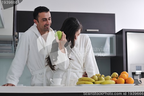 Image of young couple have fun in modern kitchen